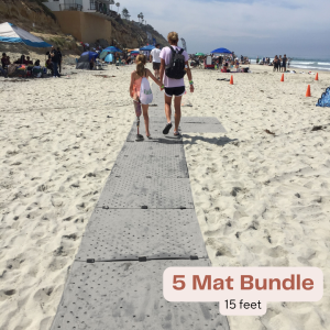 A mom and daughter who uses a prosthetic leg walk on the grey Access Trax path at the beach. Text overlay reads "5 mat bundle - 15 feet).